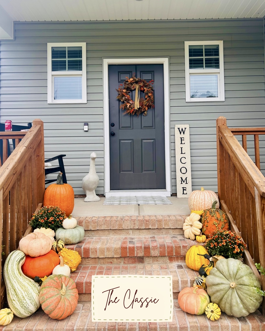 Classic pumpkin arrangement with mums framing a gray front door